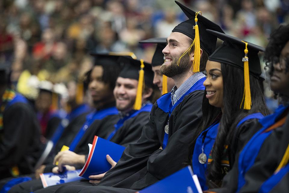 students sitting at commencement