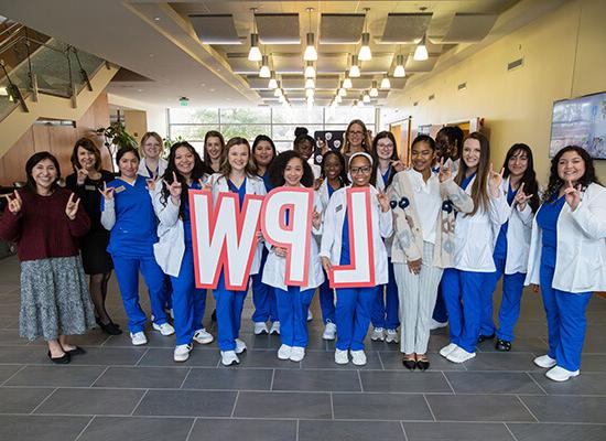 Group of 在线博彩 nursing students holding the letters LPW